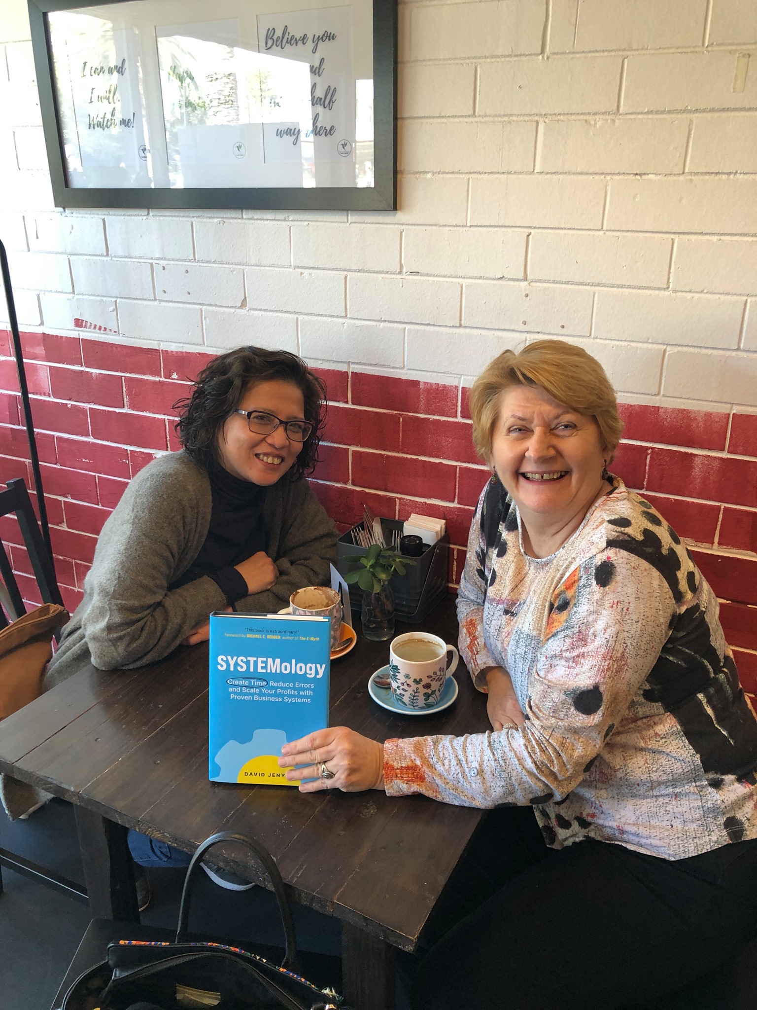 Esther Anderson with the SYSTEMology book